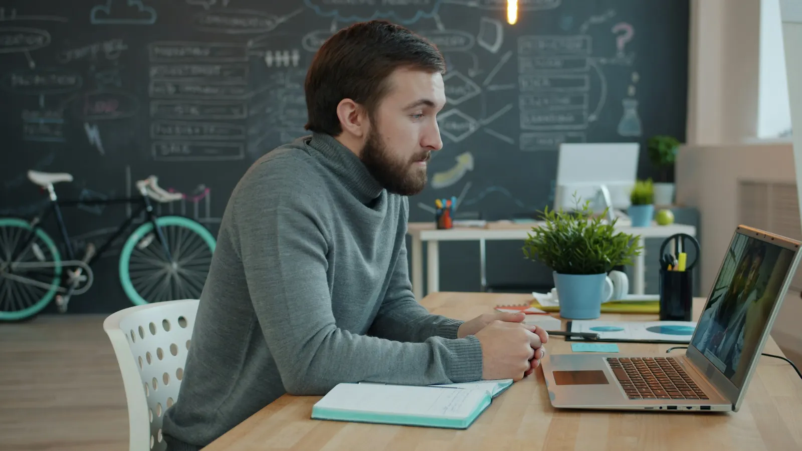 Small-business owner working through monthly bookkeeping on a laptop